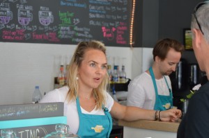 Laura Draeger, owner of Dilly Dally Coffee Cafe, serves as customer. (Alexander Quon)