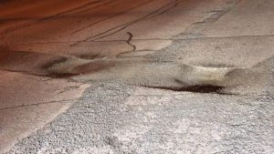 Damage-causing potholes located along Innes Road in Ottawa. Source: CBC/Alex Liculescu